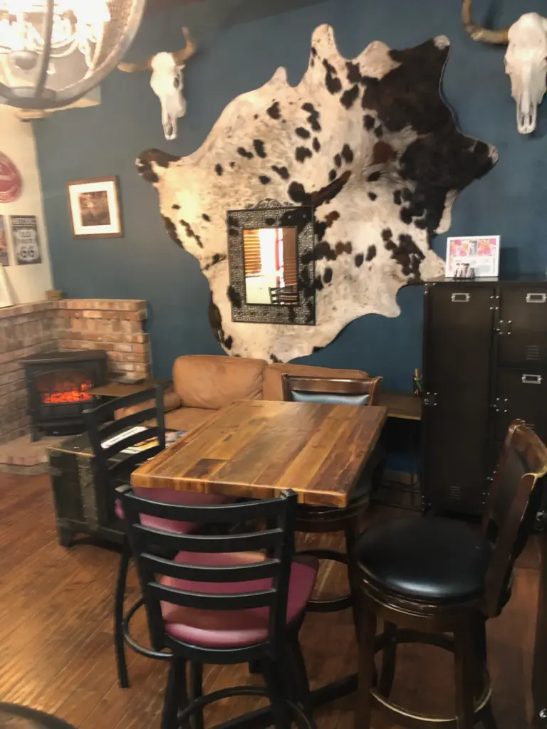 Table and fireplace at Last Call: private events room at Swallow's Inn