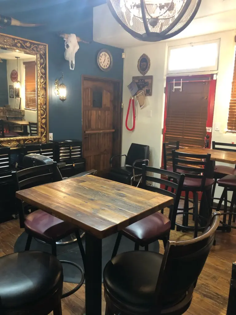 Tables and wall decorations at Last Call: private events room at Swallow's Inn